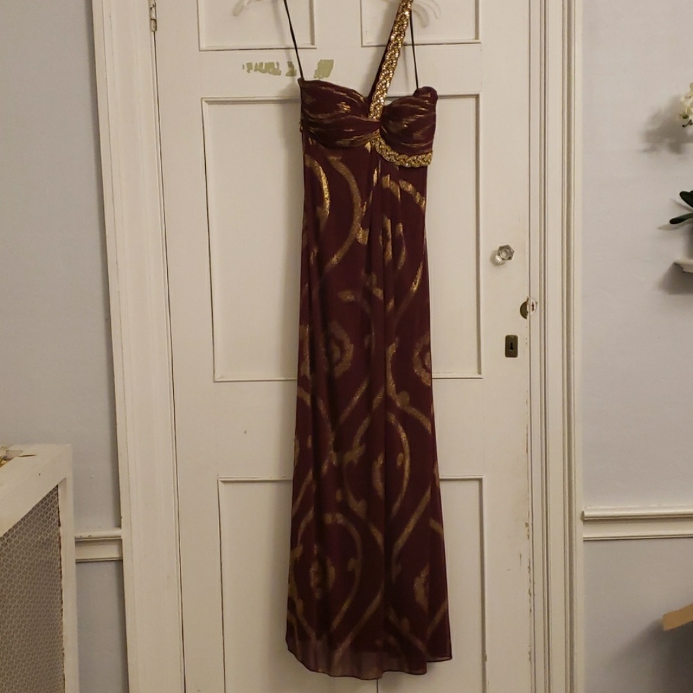 Maroon with gold single shoulder gown